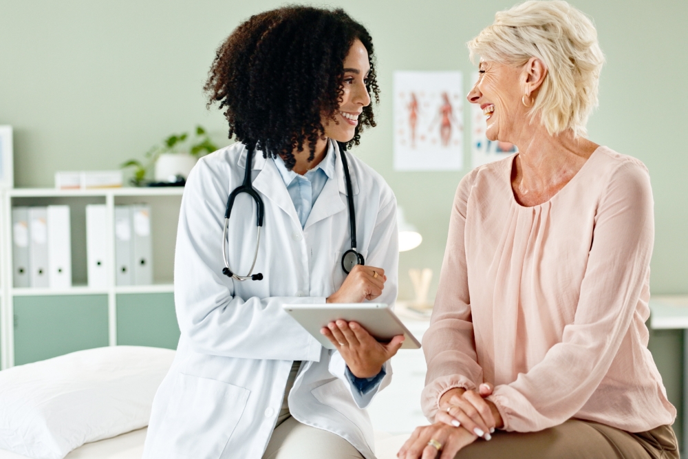 Doctor talking with a happy patient